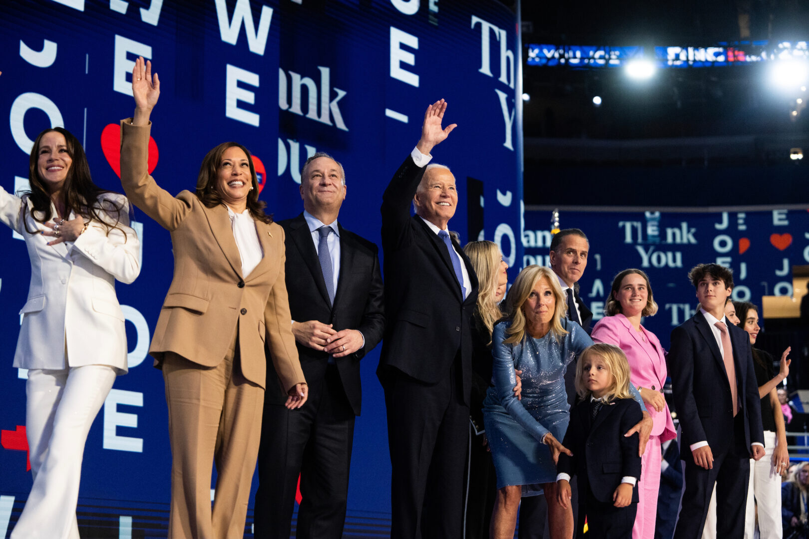 President Joe Biden, center, and Vice President Kamala Harris, second from left, appear with their families after Biden addressed the Democratic National Convention at the United Center in Chicago on Monday.