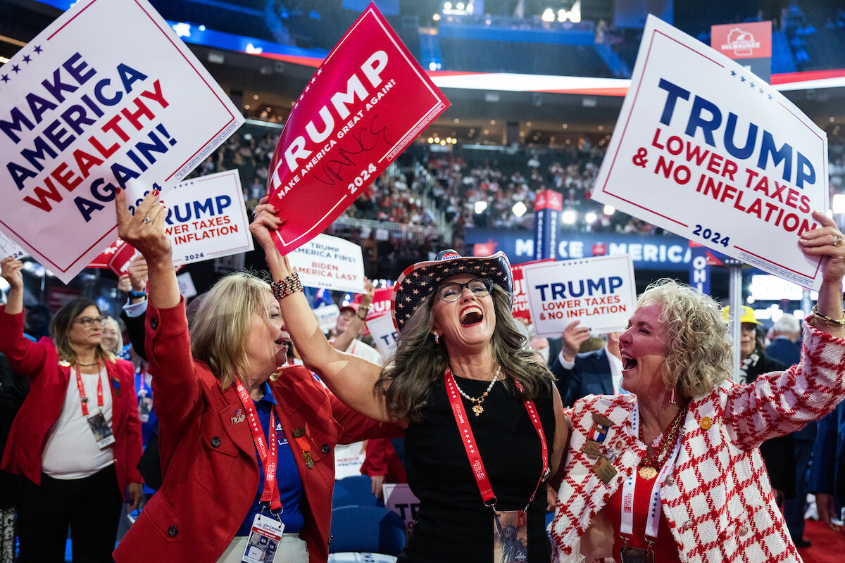 Nebraska delegates dance on the floor of the Fiserv Forum on Monday during the first day of the Republican National Convention in Milwaukee.