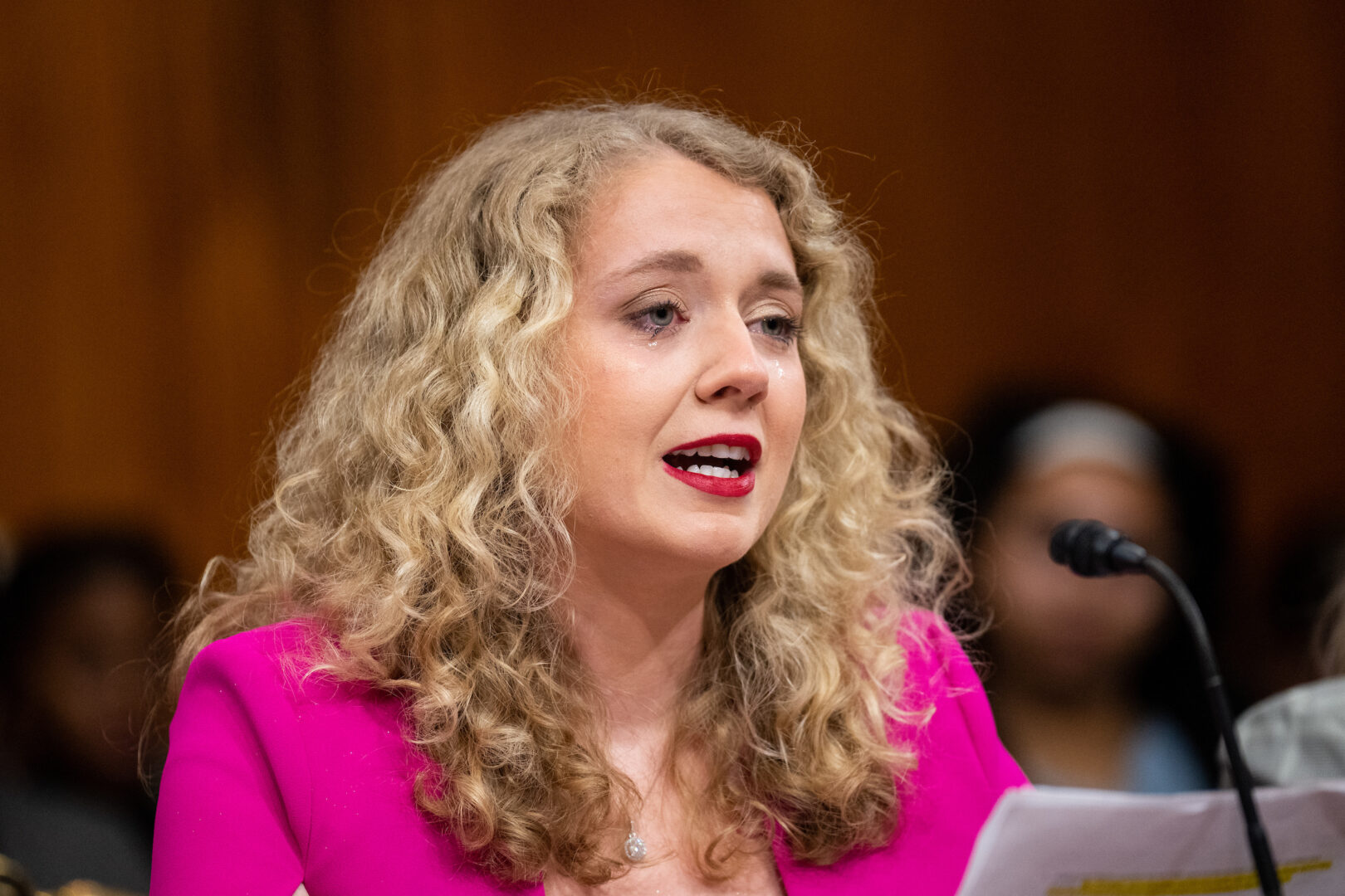 Allie Phillips tears up as she testifies about her abortion during a Senate Budget Committee hearing on Feb. 28.