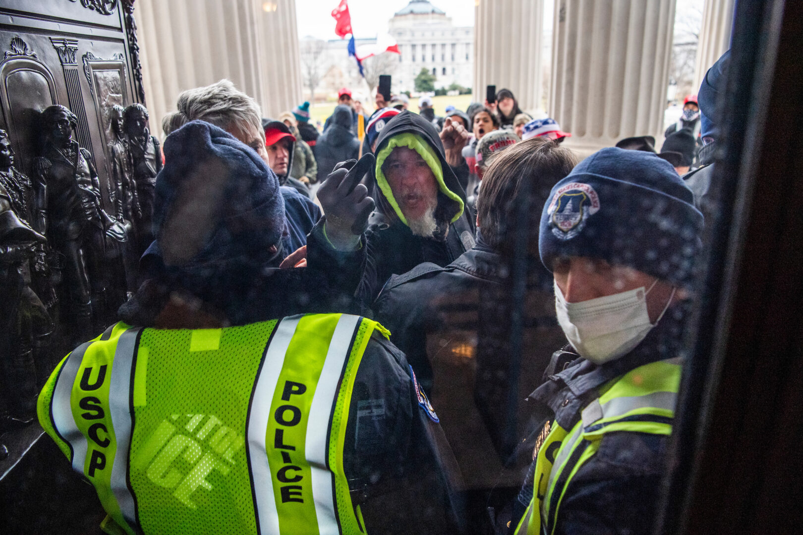 Officers block people from entering the Capitol on Jan. 6, 2021. An effort to honor police for their actions that day has stalled.