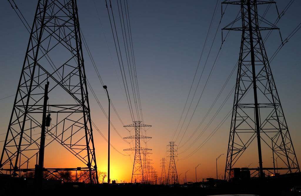 Republicans often view a permitting overhaul as a way to cut through environmental reviews, while Democrats think of it as a way to speed low-carbon power projects and decouple from fossil fuels. Above, high-voltage electricity transmission towers and lines in Texas.