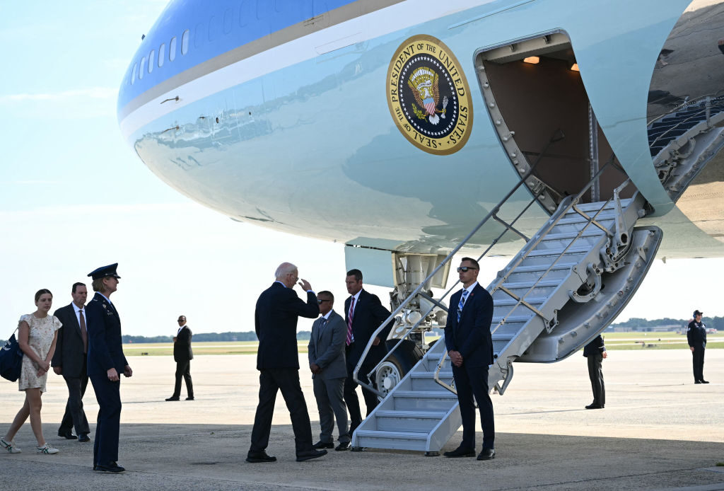 President Joe Biden salutes as he boards Air Force One at Joint Base Andrews in Maryland on Wednesday en route to Italy. 