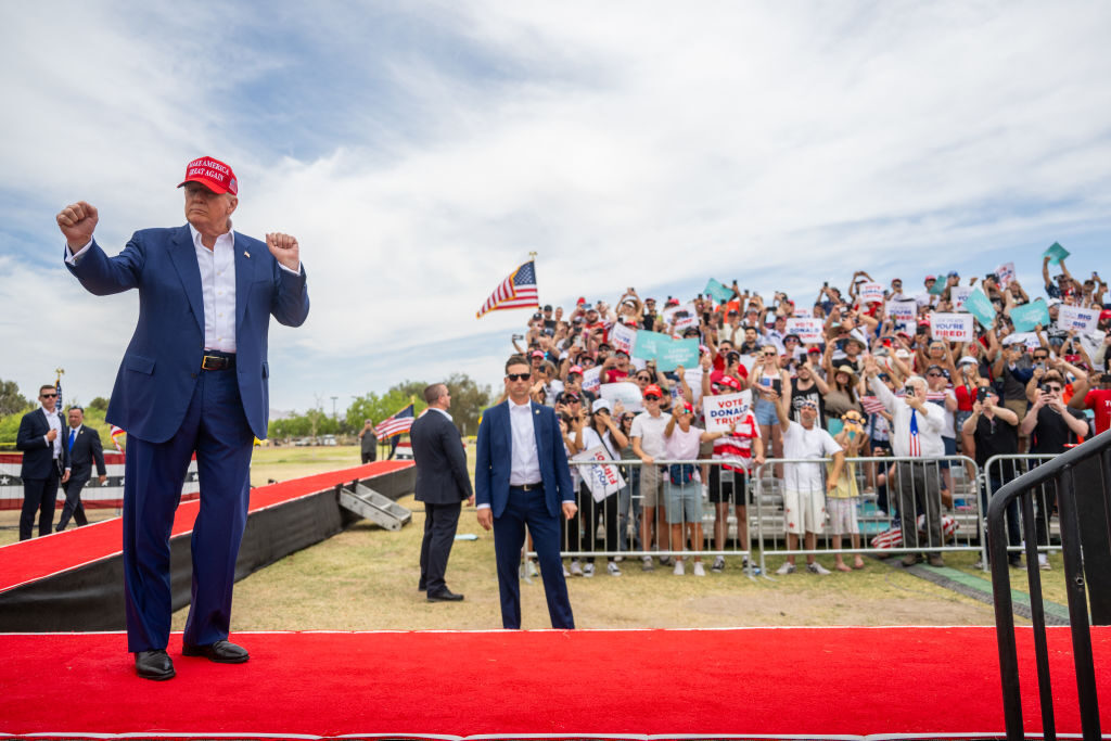 Republican presidential candidate Donald Trump dances upon arrival at a campaign rally at Sunset Park in Las Vegas on Sunday.