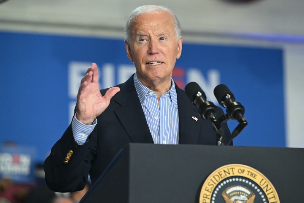 President Joe Biden speaks during a campaign rally in Madison, Wis., on Friday, vowing to continue his reelection bid. 