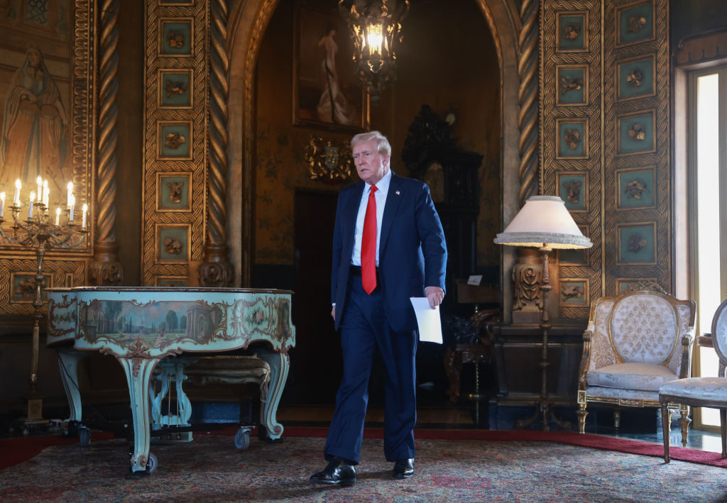 Republican presidential nominee and former President Donald Trump arrives for a press conference at his Florida resort on Aug. 8. 