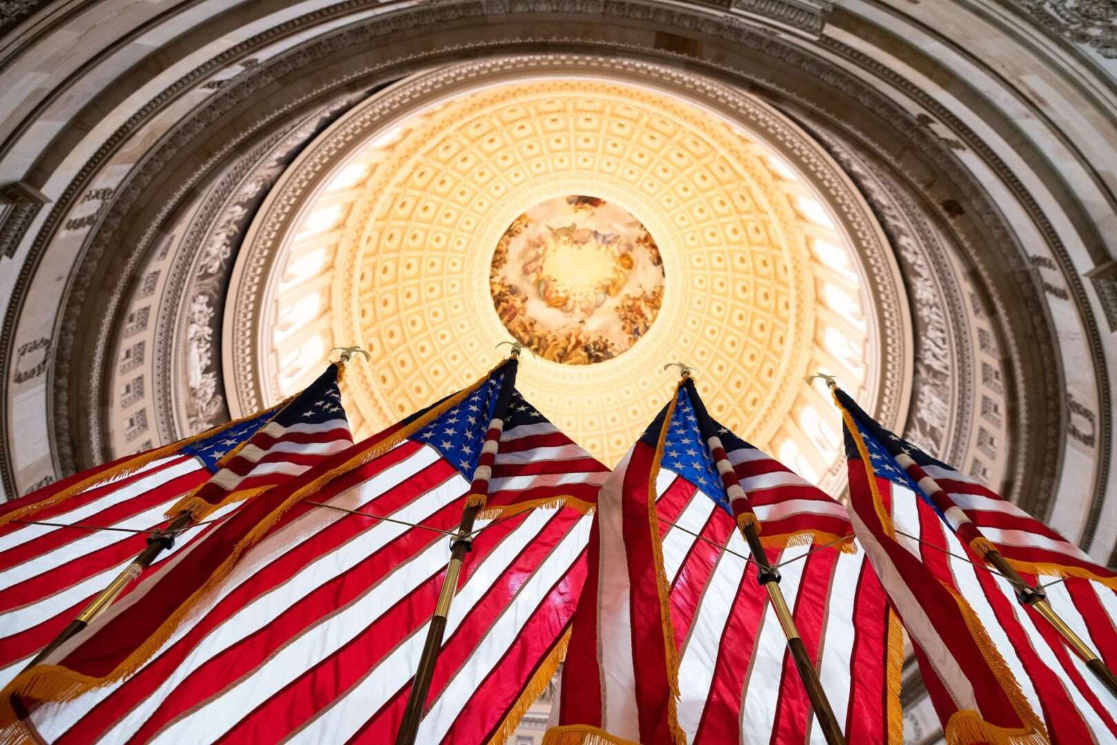 American flags stand  in the Capitol Rotunda in December ahead of a ceremony to recognize police officers who defended the Capitol on Jan. 6, 2021. 