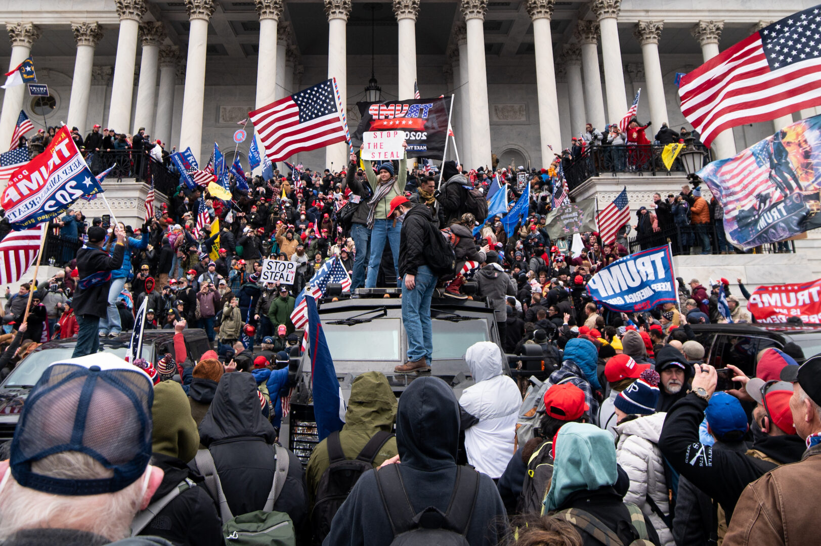 Trump flags fly as rioters take over the steps of the Capitol on the East Front on Jan. 6, 2021, as Congress works to certify Electoral College votes.