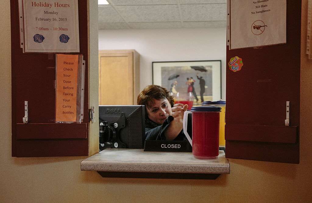 Vanessa Leavitt puts out Tang and Kool-Aid for patients to take with their methadone treatment at CAP Quality Care clinic in Westbrook, Maine, on Jan. 22, 2015.