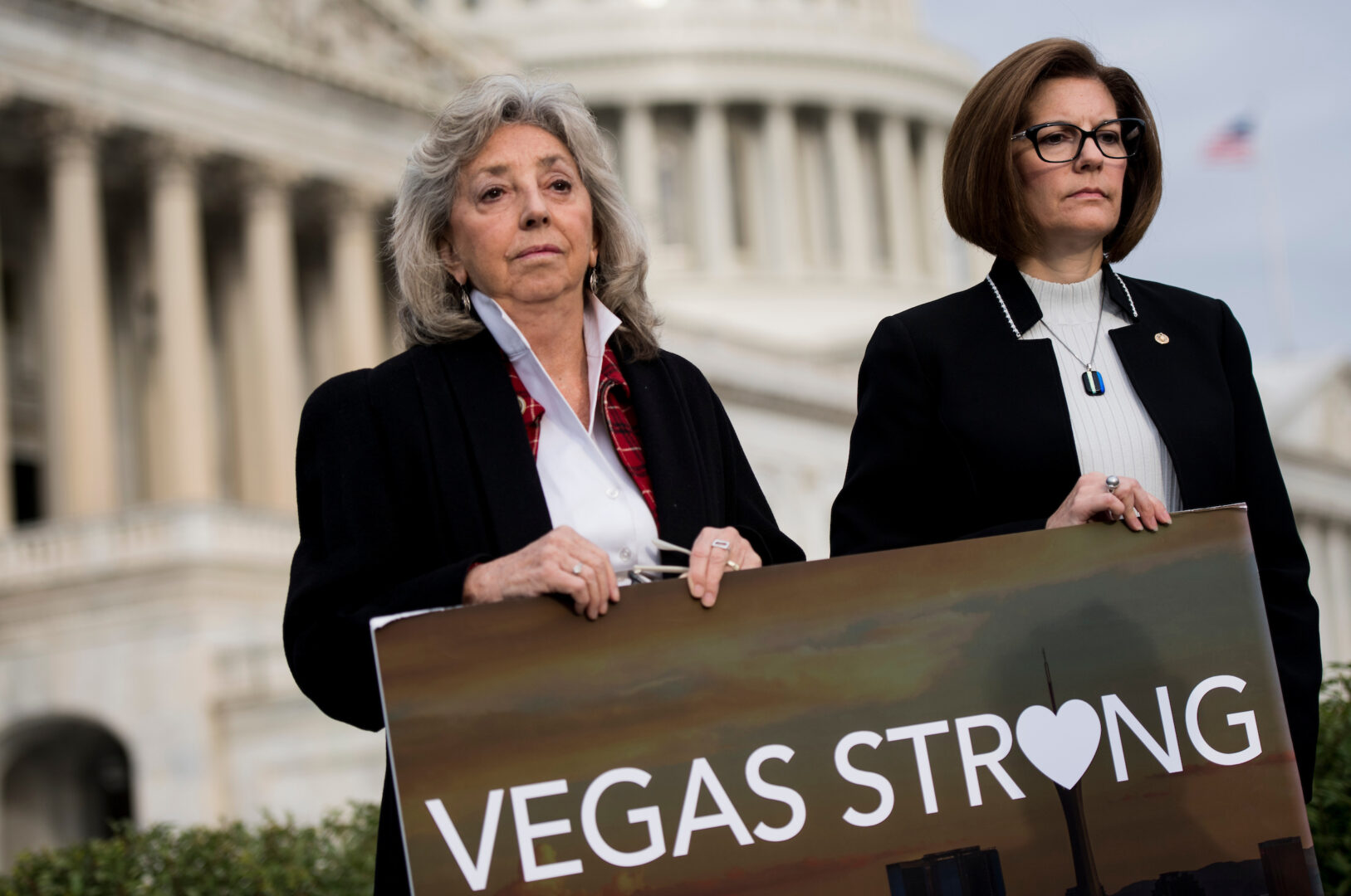 Back in 2017, from left, Rep. Dina Titus, D-Nev., and Sen. Catherine Cortez Masto, D-Nev., hold a Vegas Strong sign during a news conference to call for a hearing and examine the use and legality of "bump stocks." 