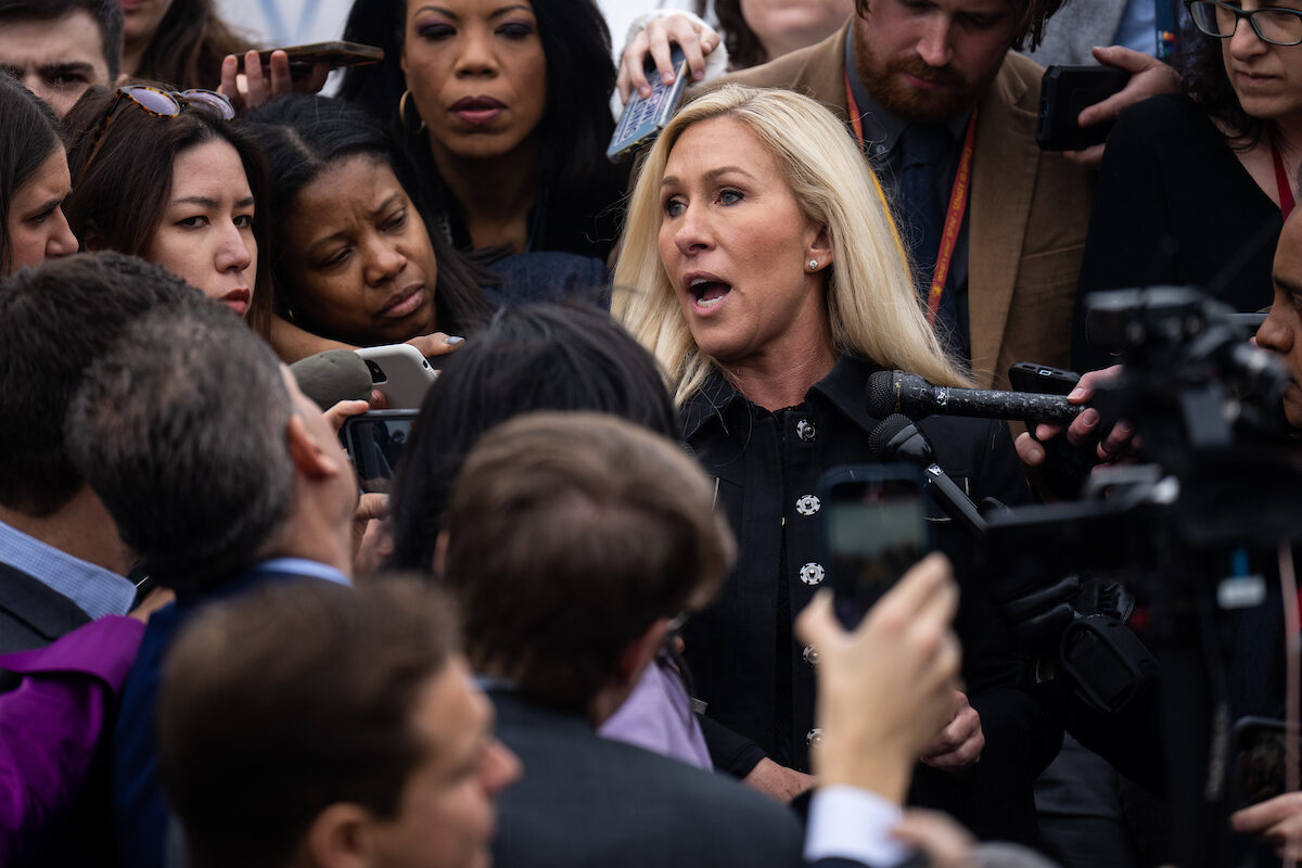 Rep. Marjorie Taylor Greene speaks to the media on the House steps of the Capitol after filing her motion to vacate Speaker Mike Johnson on March 22.