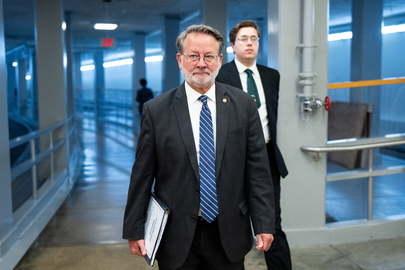 Chair Gary Peters, D-Mich., helped broker a new version of a bill to ban lawmaker stock trading, which advanced out of the Senate Homeland Security and Governmental Affairs Committee on Wednesday. 