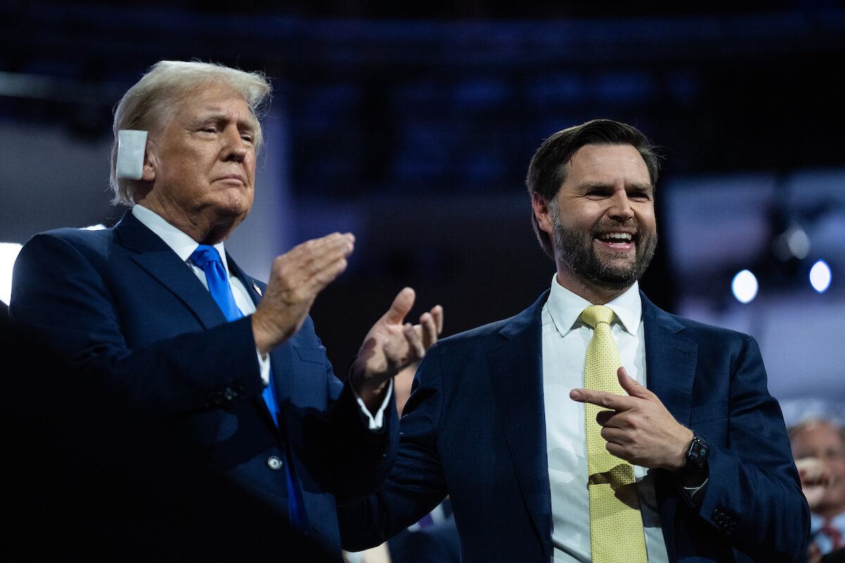 Former President Donald Trump, the Republican presidential nominee, is pictured with his running mate Sen. JD Vance, R-Ohio, right, in the Fiserv Forum on the second day of Republican National Convention in Milwaukee on July 16. 