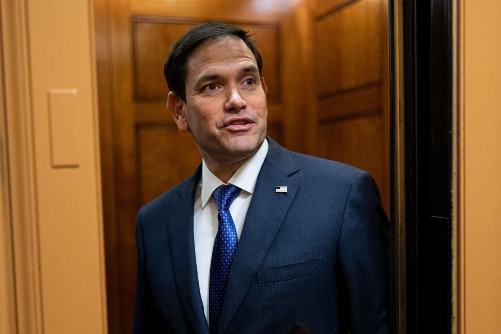 Sen. Marco Rubio, R-Fla., stops to talk to reporters as he arrives in the Capitol in January. Rubio has  reintroduced legislation that would deny business deductions for traveling to seek an abortion or gender-affirming care for minors.