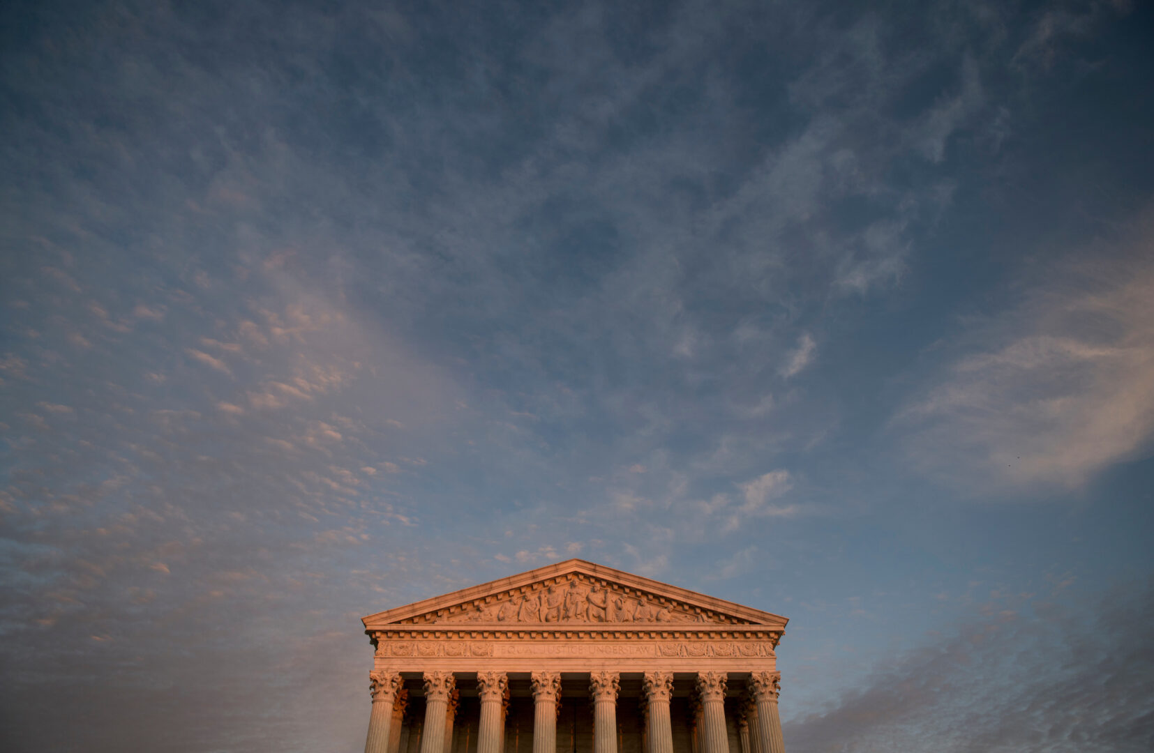 The Supreme Court building at sunset. 