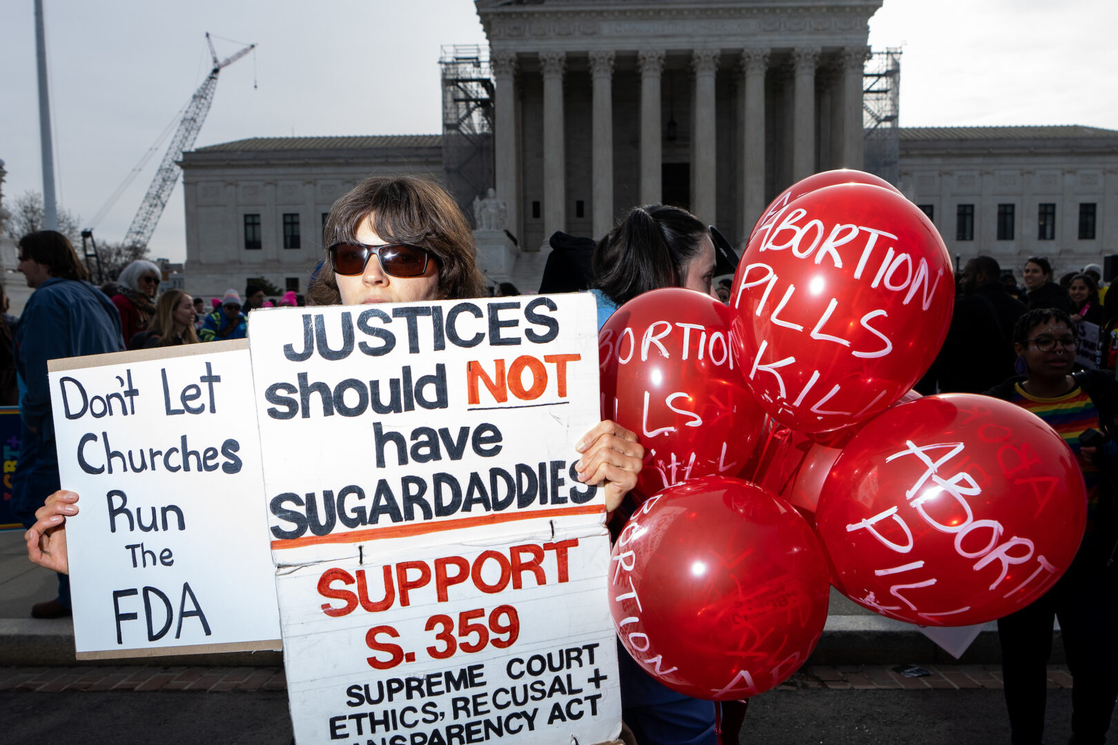 Activists protest at the Supreme Court as the court hears oral arguments in March in a case about access to mifepristone, the drug used in medication abortions. 