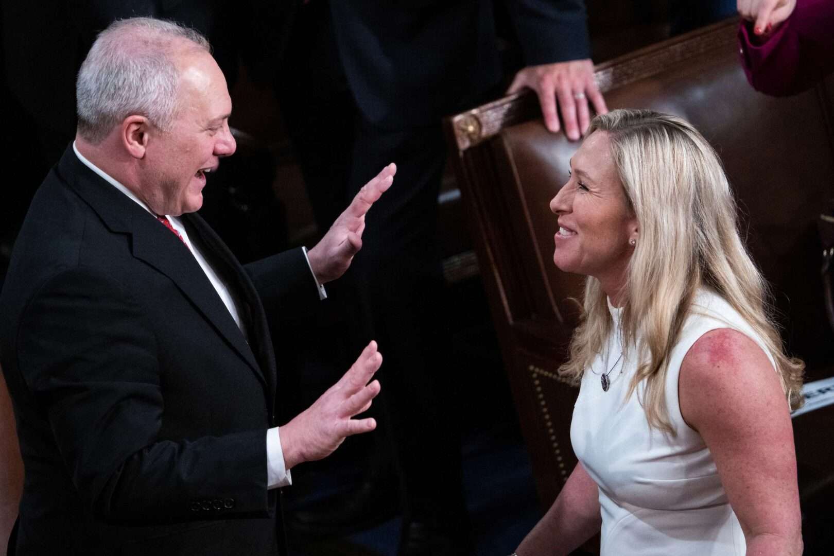 Rep. Marjorie Taylor Greene, R-Ga., and House Majority Leader Steve Scalise, R-La., talk before President Joe Biden’s State of the Union address in the House chamber Tuesday.