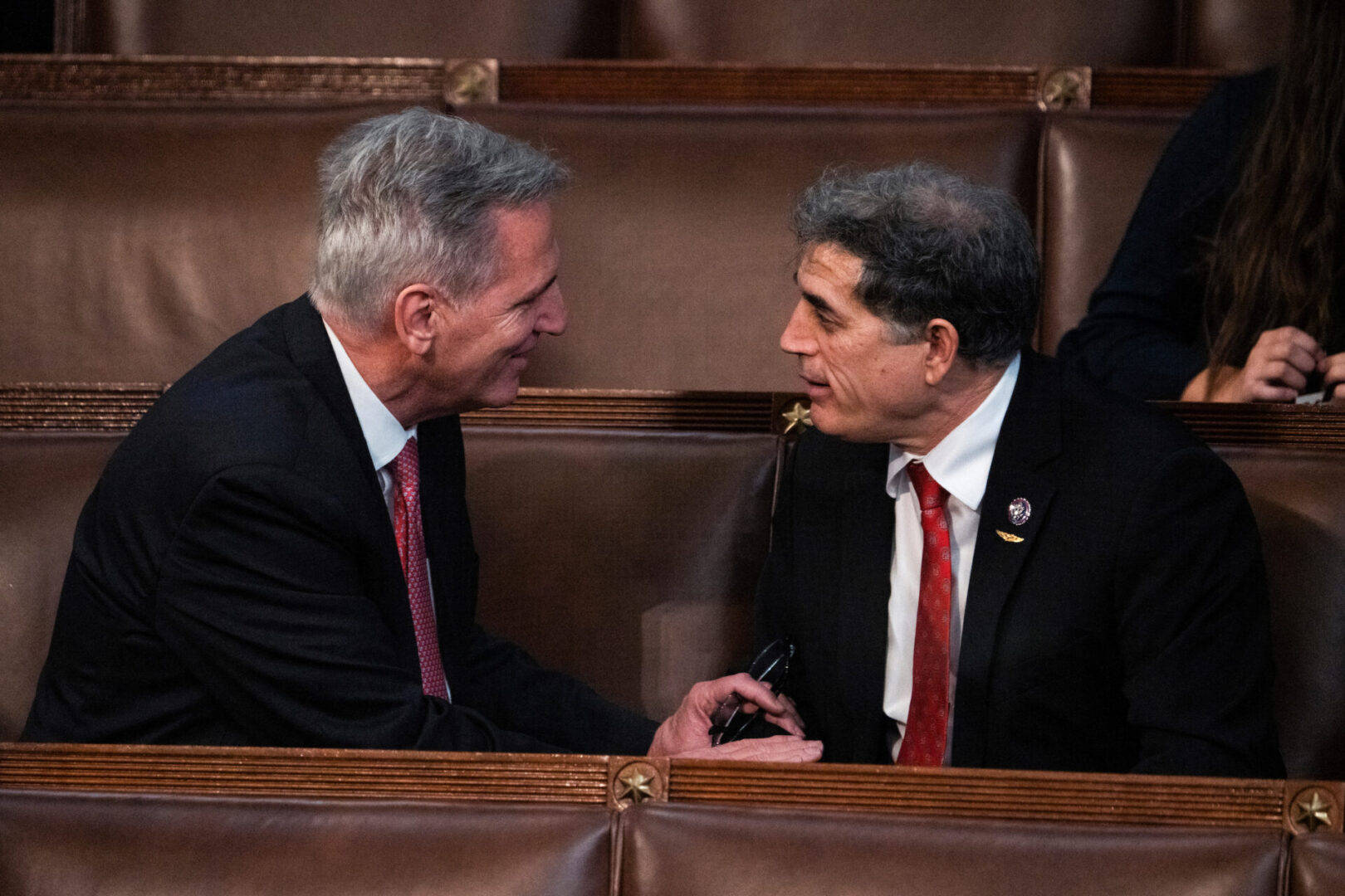 House Republican leader Kevin McCarthy, R-Calif., left, speaks with Georgia Republican Andrew Clyde on Thursday. Clyde, who had been opposed all week, voted for McCarthy to be speaker on Friday. 