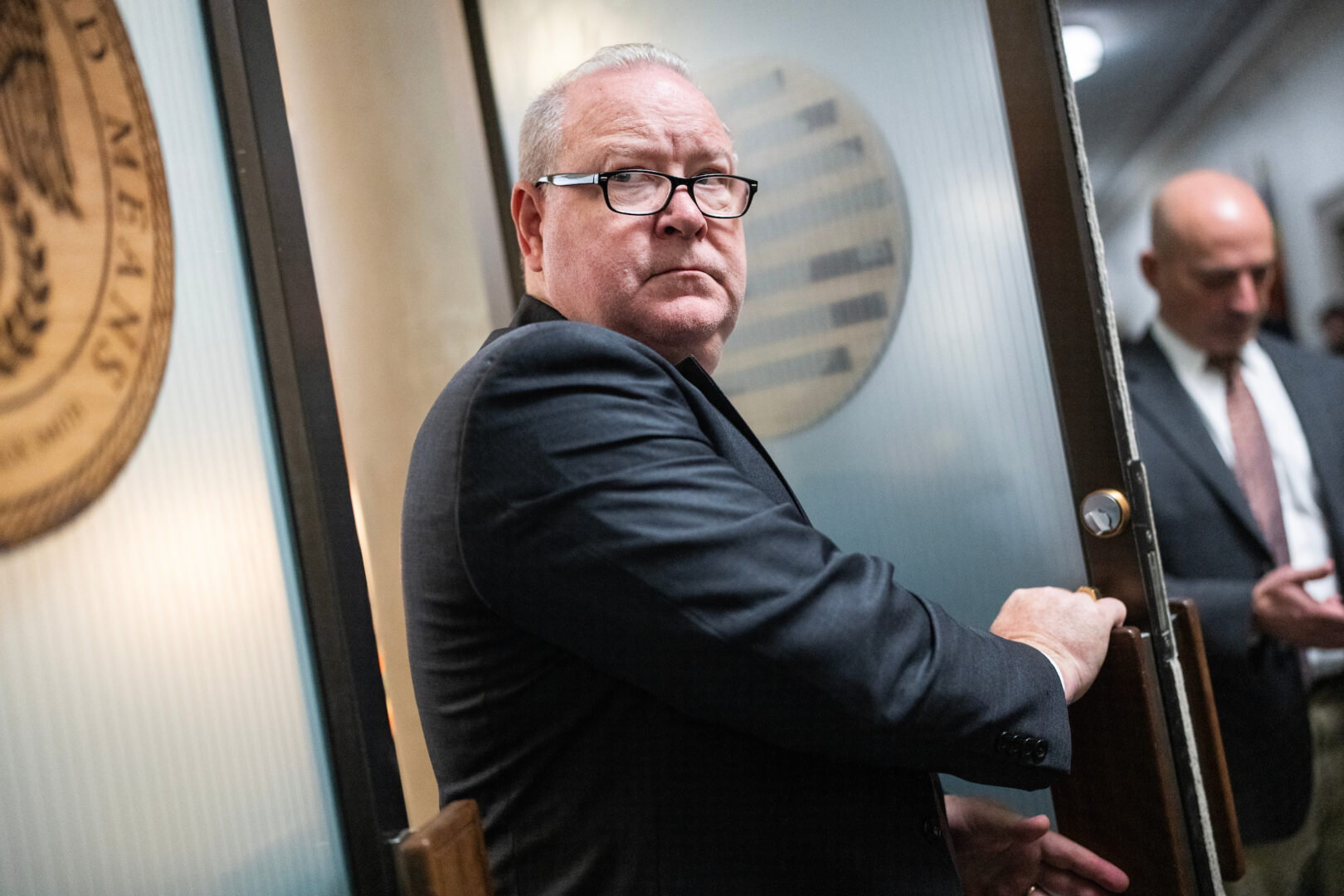 Rep. Larry Bucshon leaves a House Republican Conference meeting in the Longworth Building in October 2023.