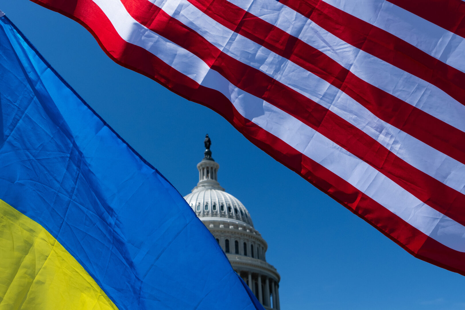 The Capitol is seen through American and Ukrainian flags on Tuesday.