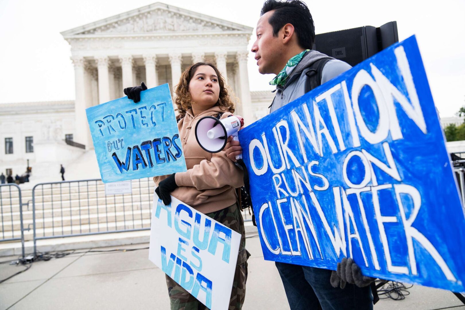 Jaime Sigaran of American Rivers and his sister Bethsaida attend a rally to call for protection of the Clean Water Act outside the Supreme Court on Monday. 